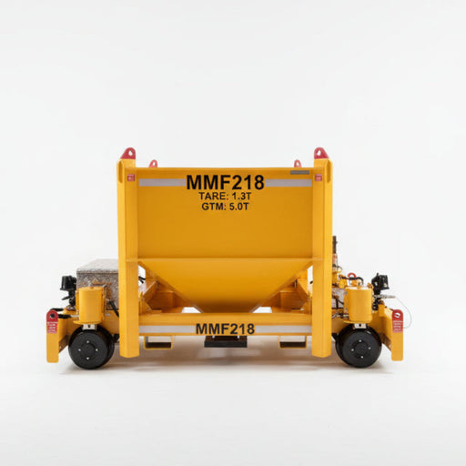 yellow concrete rail trolley in a workshop